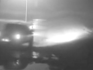 Surveillance camera shot of truck speeding away from the scene.