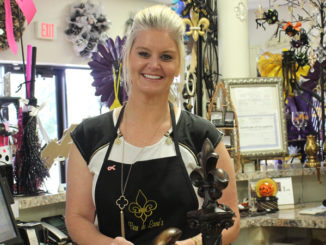 Elana Bourgeois-Folse displaying many of the products at the store.