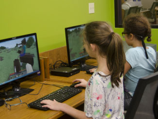 Minecraft players explore their world.