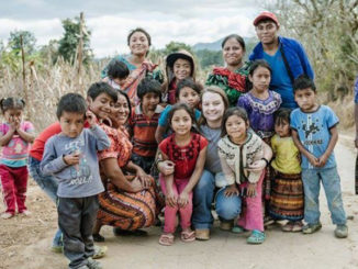 Kelsey King with children on missionary trip in Guatemala.