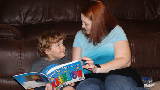 Erin Frickey reading to her son, Rory, who was diagnosed with autism.