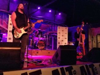 Dustin Cole performing on stage.