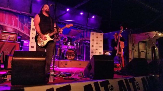Dustin Cole performing on stage.
